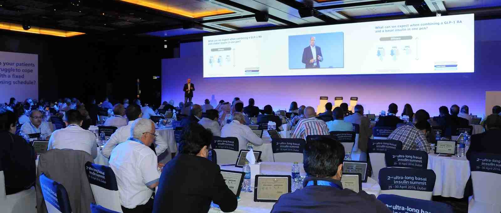 Dr Sultan lecturing with his team of experts